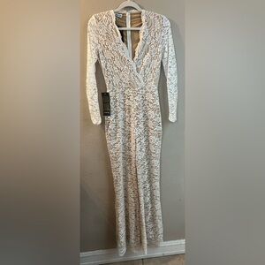 New with tags! BEBE jumpsuit. Size XS. Fully lined except for sleeves.